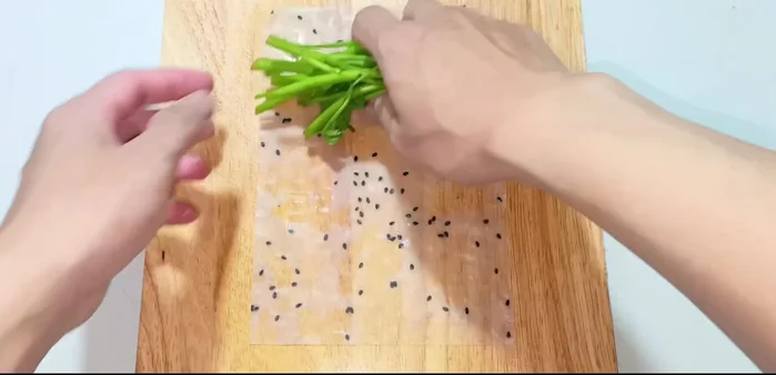 Prepare the rice paper: Dip rice paper in water to soften.
