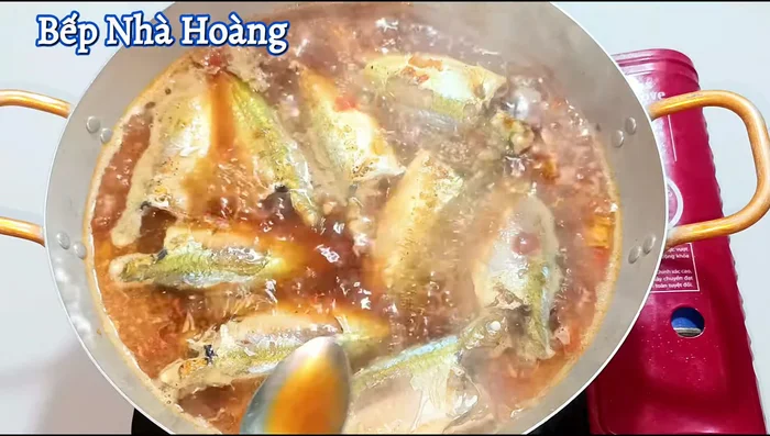 Season the broth to taste. Simmer at medium heat, occasionally spooning the braising liquid over the fish to keep it moist and maintain color, until the water is reduced.
