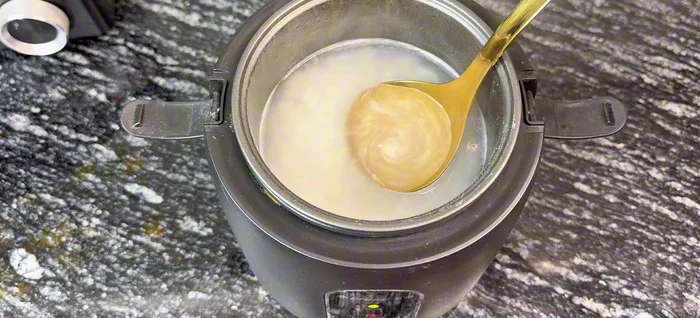 Add rice water (a key ingredient for flavor and tenderness).