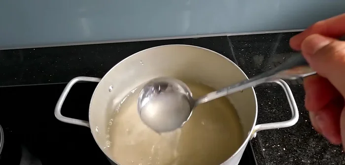 Cook the agar mixture over medium-high heat until it boils, then reduce heat and simmer for 15-20 minutes. Stir in the pandan essence. Pour into molds and let cool completely.