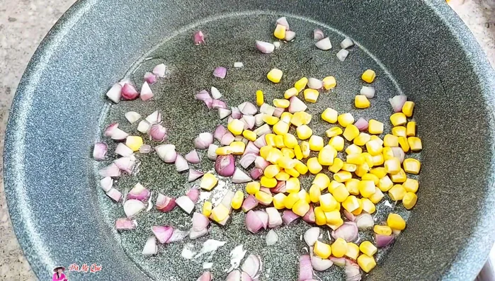 Add diced carrots, vegetarian ham, and sweet corn. Stir-fry for about 1 minute.
