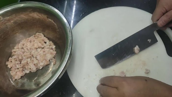 Clean the pig intestines by rubbing them with salt and blanching them in hot water. This will shrink them and prevent them from breaking during stuffing.