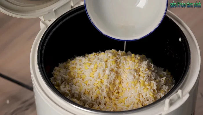 Add coconut milk and water to the rice cooker. (1 cup of coconut milk and 1 cup of water for 2 cups of rice).