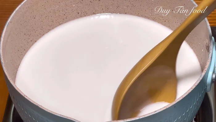 Cook coconut milk sauce over low heat until it gently boils and thickens (1-2 minutes).