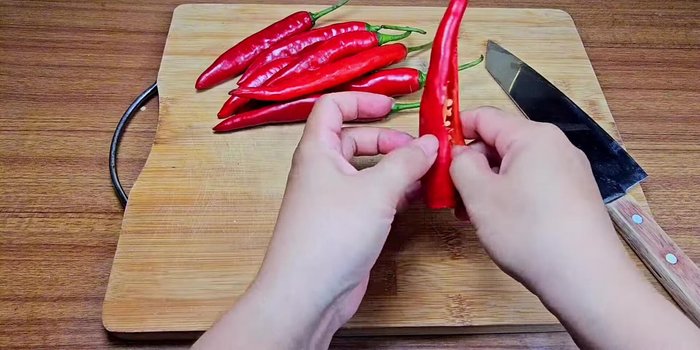 Prepare the chilies: Remove seeds and chop into small pieces. Grind the chilies using a mortar and pestle.