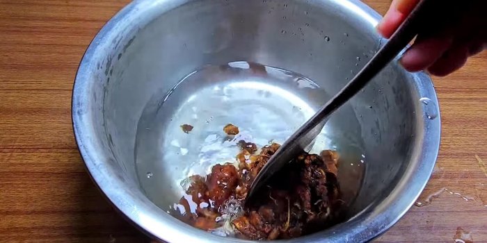 Prepare tamarind pulp: Mix tamarind pulp with boiling water, mash, and strain through a sieve to remove seeds and pulp.