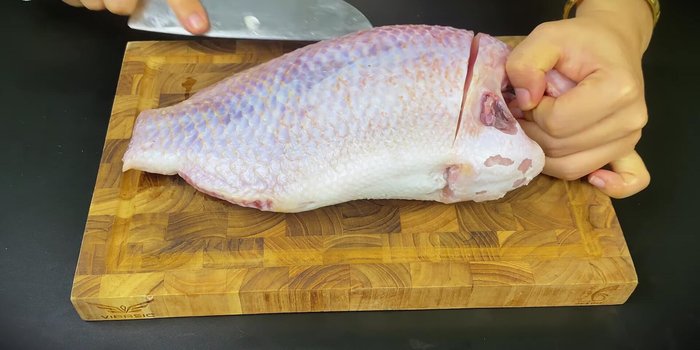 Wash the fish thoroughly with vinegar and salt to remove slime. Fillet the fish, or buy pre-filleted fish.