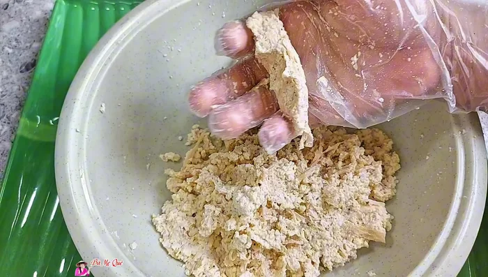 Shape the tofu mixture into a long shrimp shape, with one end larger than the other (105.799). Adjust the amount of filling based on desired shrimp size (114).