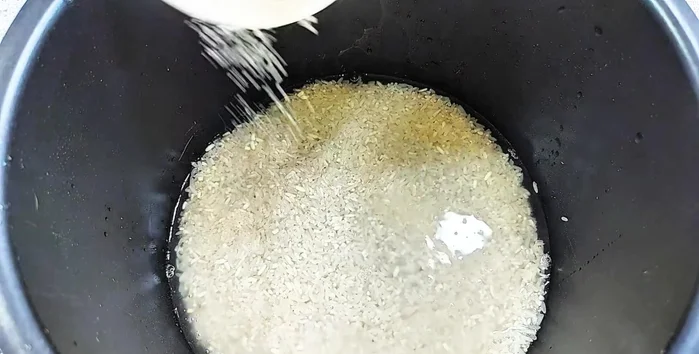 Season the rice with sugar, vegetarian seasoning, and soy sauce.