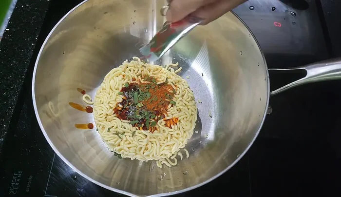 Add the spicy noodle sauce packet and water.