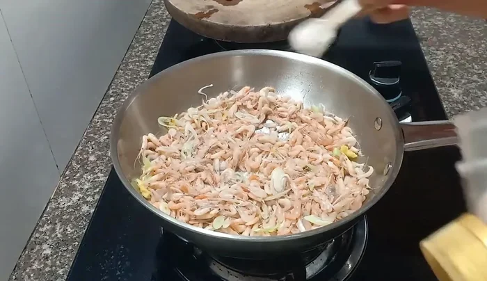 Add salt, a little extra salt, and fish sauce.