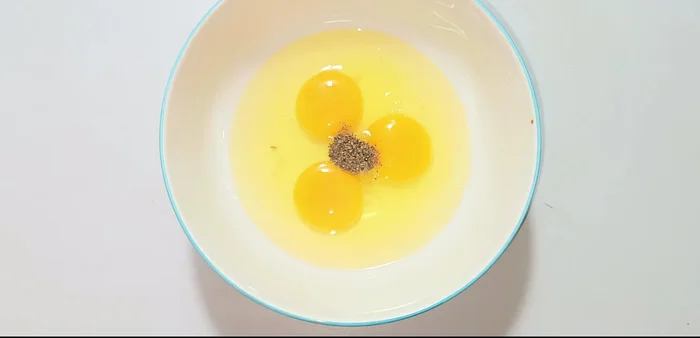 Whisk eggs with MSG, fresh ground pepper, sugar, and fish sauce until well combined.