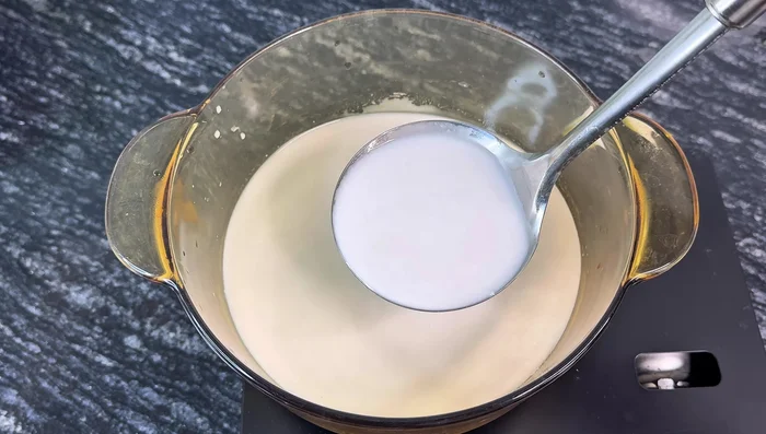 Boil coconut milk until it slightly boils.