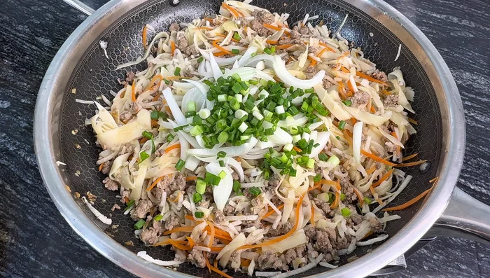 Add onion and green onion to the filling, season to taste and set aside to cool.