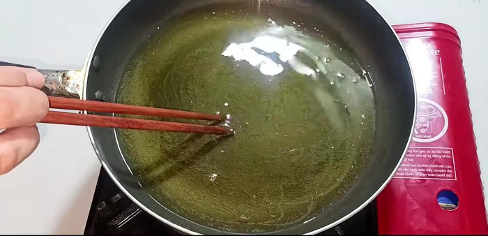 Heat cooking oil in a pan over medium heat. Add the quail eggs and fry for about 1 minute, then stir gently.