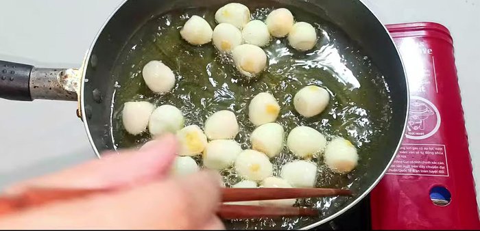 If any eggs puff up, pinch them to deflate. Continue stirring until slightly golden brown.