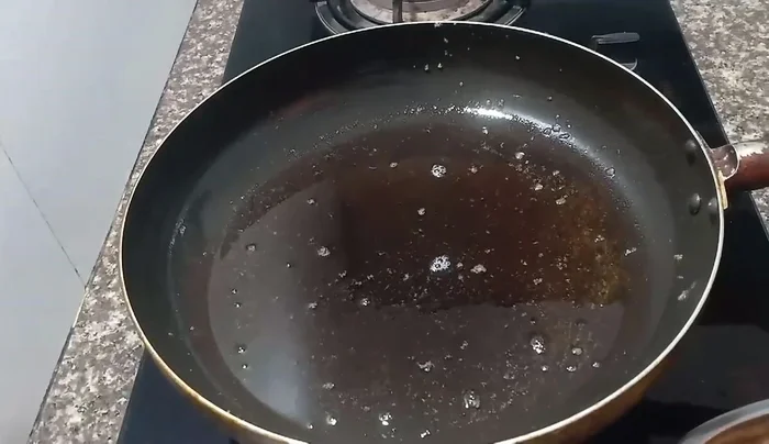 Heat oil in a pan over medium heat.