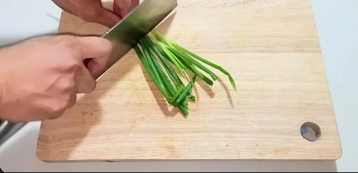 Finely chop green onions for garnish.