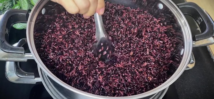 Steam the rice in a steamer for 20 minutes, creating holes in the rice to allow even cooking. Stir once after 20 minutes.