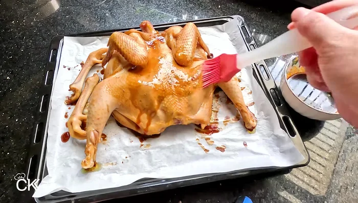 Remove the chicken, brush with the remaining honey (30g) and some of the marinade. Return to the oven and bake for another 10-15 minutes, increasing the temperature by 10°C each time. Repeat 3-4 times.
