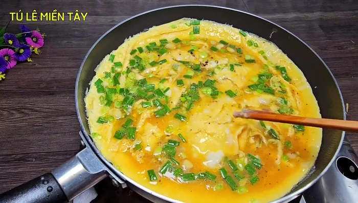 Continue cooking until the top of the egg is dry.