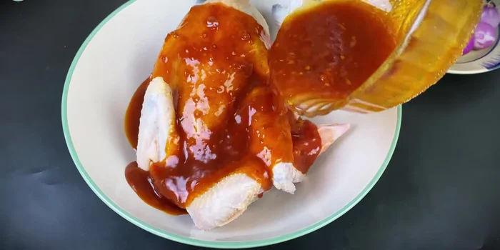 Drain the chicken and pour the sauce over it. Massage the sauce into the chicken, marinating for at least 15 minutes (30 minutes recommended).
