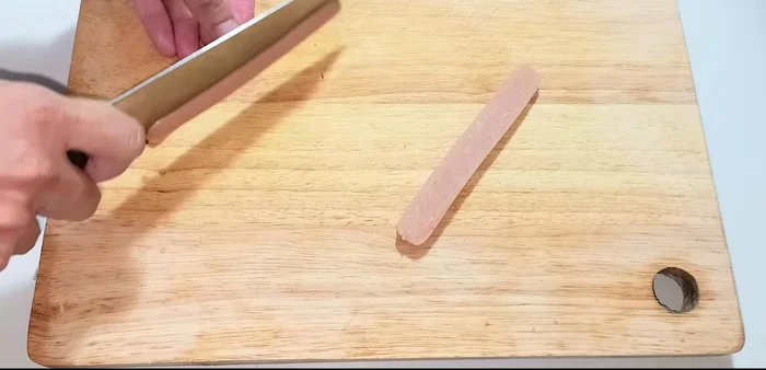 Slice sausages into thirds, then cut each third into small cubes. [56.12]