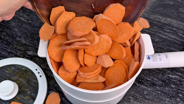 Steam the sweet potatoes for 20 minutes until soft.