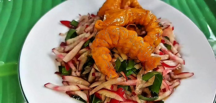 Serve the salad, garnished with additional shrimp.