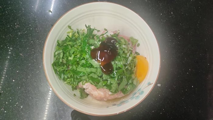 Add chopped green onion leaves, shallots, and an egg.