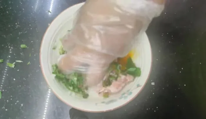 Wrap the pork mixture in betel leaves.