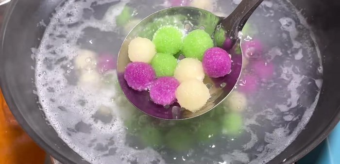 Immediately transfer the cooked balls to a bowl of cold water to stop the cooking process.