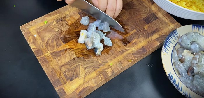 Peel and roughly chop shrimp.