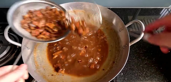 Add about 500-600ml of cold water to the tamarind pulp to extract any remaining flesh. Stir well. This will yield roughly 1 kg of tamarind pulp.