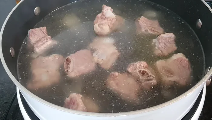 Simmer the pressure-cooked ribs for another 10 minutes until tender. (344.639)