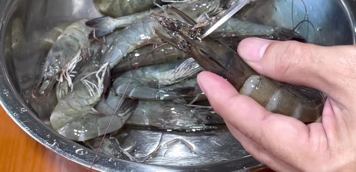 Prepare the shrimp: Cut off the legs, head (just past the eye), and beard. Remove the poop bag from the head. If using large shrimp, remove the back vein.
