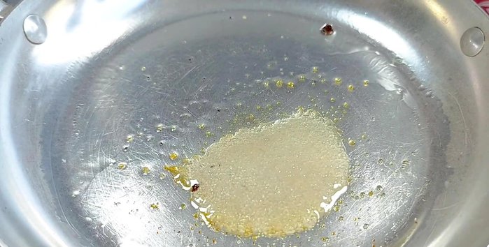 In a separate pan, caramelize sugar, add spices, vegetarian fish sauce, and water.