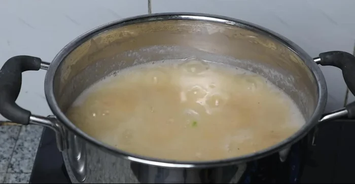 Adjust seasoning with sugar, fish sauce, and concentrated juice. Simmer for 1-2 minutes.