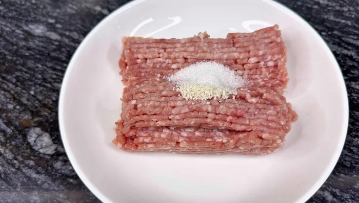 Marinate the pork: Mix pork with seasoning powder, sugar, ground pepper, minced onion and garlic, and green onions. Let it sit for 5-10 minutes.