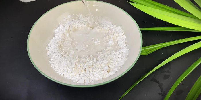 Gradually add coconut water/filtered water, mixing until a dough forms. (81.159)