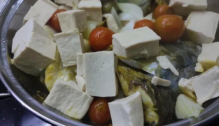 Cook for about 15 minutes after the water boils, adding a little boiling water if necessary to keep the fish and beans submerged.