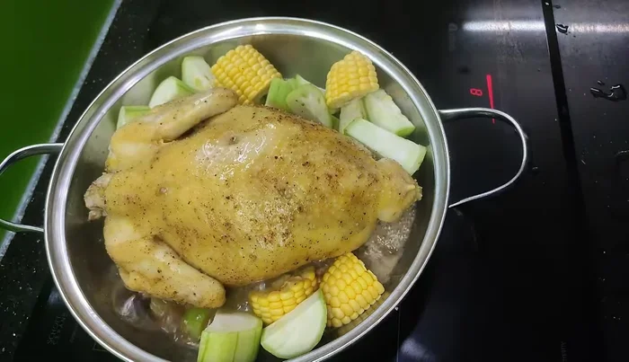 Steam until the chicken is almost cooked, then add the remaining squash and vegetables.