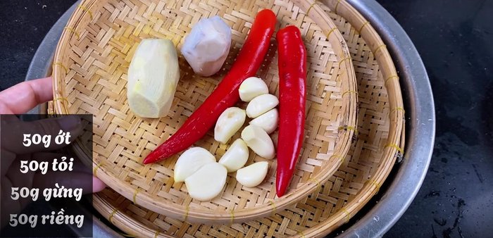 Prepare the garlic, galangal, chili, and ginger. Mince or shred as desired.