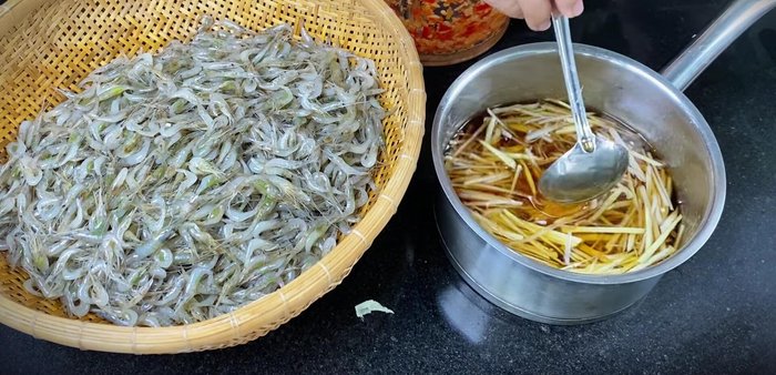Add the ginger and galangal to the warm fish sauce mixture.