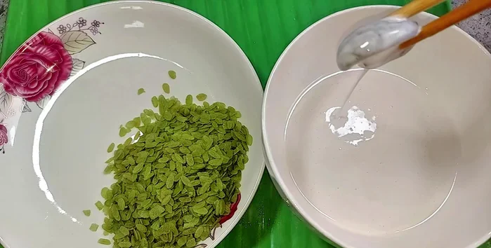 Dip each mushroom in the batter, then roll it in the green rice flakes to coat it evenly.