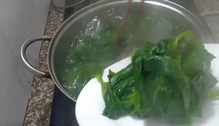 Optional: Add a spoonful of MSG (monosodium glutamate) for extra flavor. The natural sweetness of the spinach is sufficient.