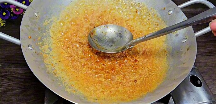 Using a spatula or similar utensil, press down on the center of the pan, tilt it slightly, and slowly pull the thickened sauce upwards to create strings. This will require a bit of finesse and practice.