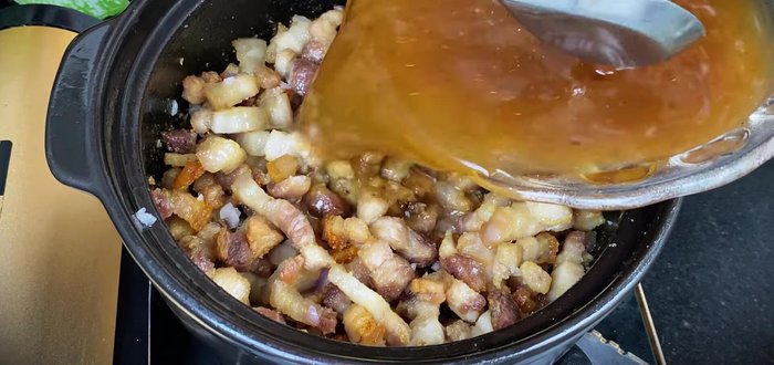 Pour the sauce mixture into the pot and bring to a boil. Simmer until the sauce thickens and deepens in color.