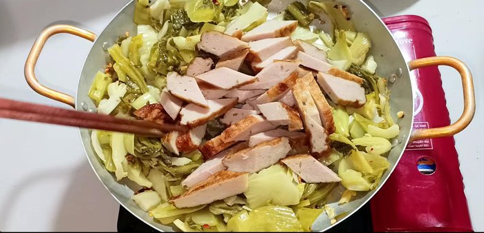 Add the fish cakes and stir-fry until heated through and slightly oily.