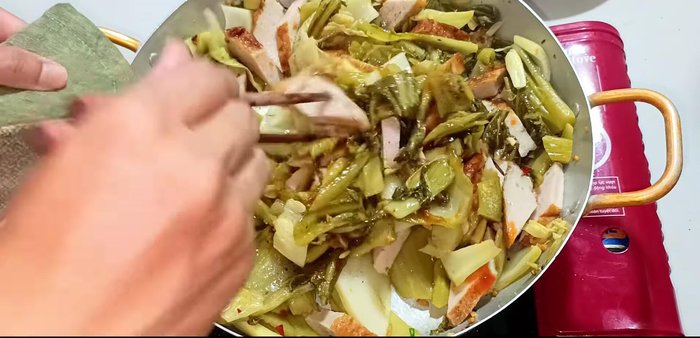 Turn the stove back on to medium heat, stir-fry until seasoning is evenly distributed.